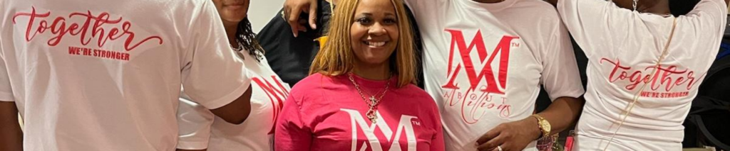 Group wearing matching pink and white logo shirts