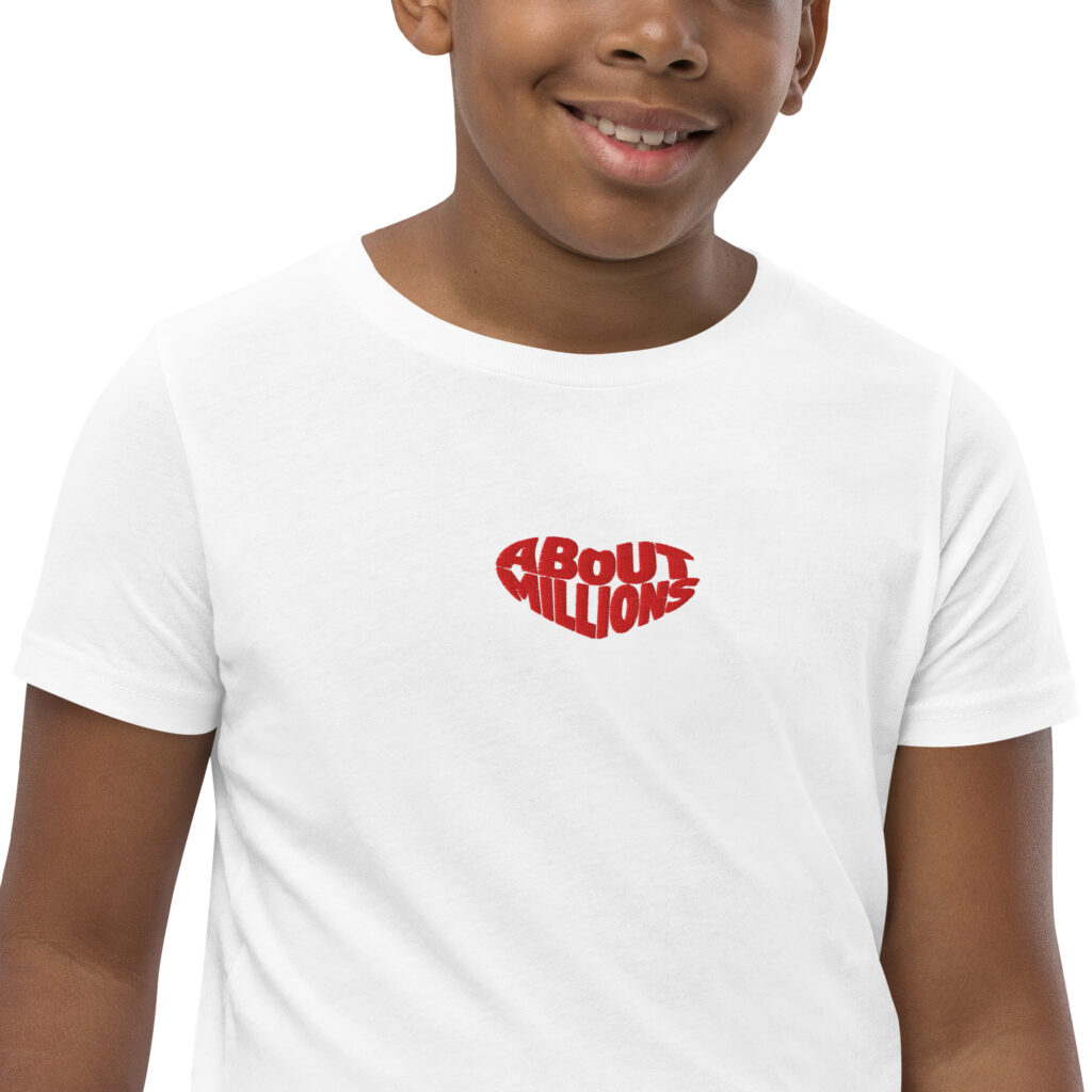 Smiling person wearing white t-shirt with red logo