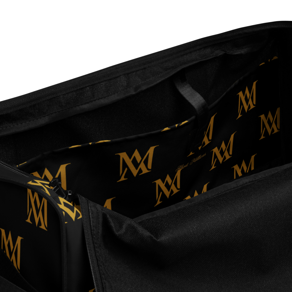 Open black bag with gold monogram lining