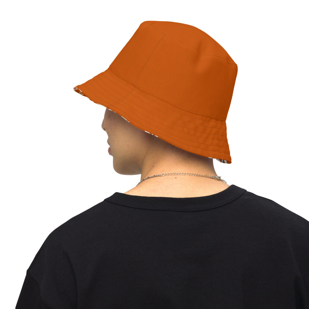 Person wearing orange bucket hat and black shirt