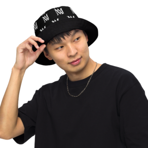Man adjusting black patterned bucket hat