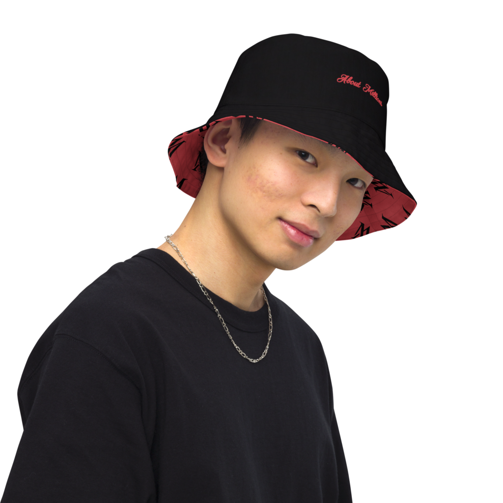 Young man wearing black bucket hat and chain