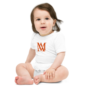 Baby wearing white onesie with orange monogram