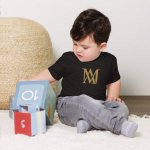 Toddler playing with colorful numbered stacking blocks