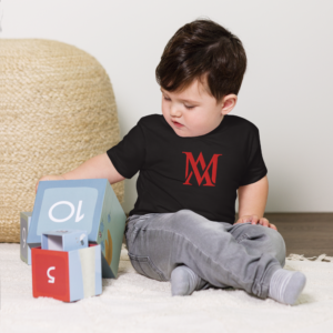 Toddler sitting on floor playing with blocks