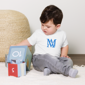 Toddler playing with number blocks on floor