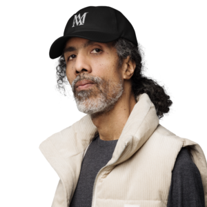 Bearded man wearing black cap and vest