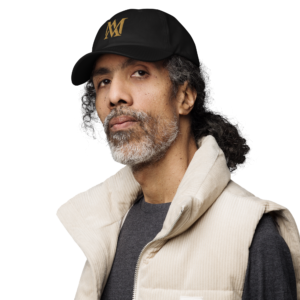 Man wearing black cap and beige vest