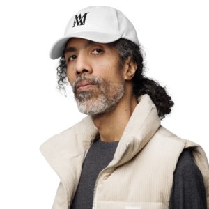 Bearded man wearing white cap and vest