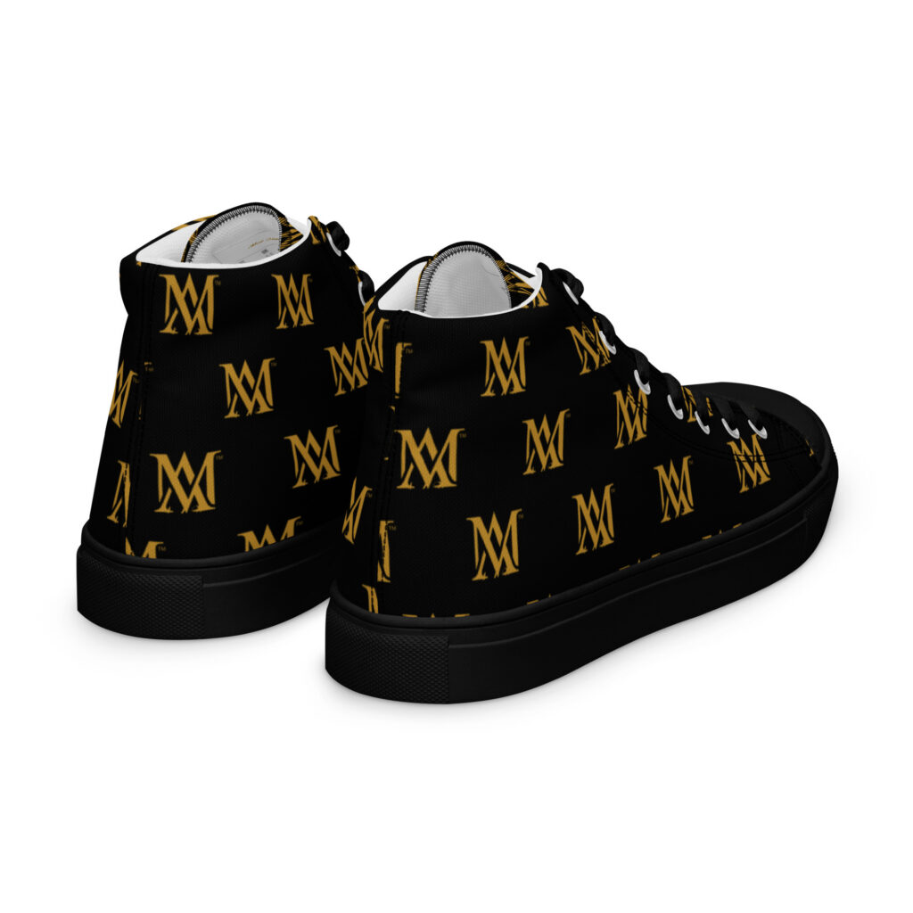 Black high-top sneakers with gold monogram
