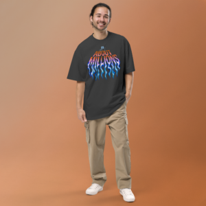 Smiling man in 'About Millions' graphic tee