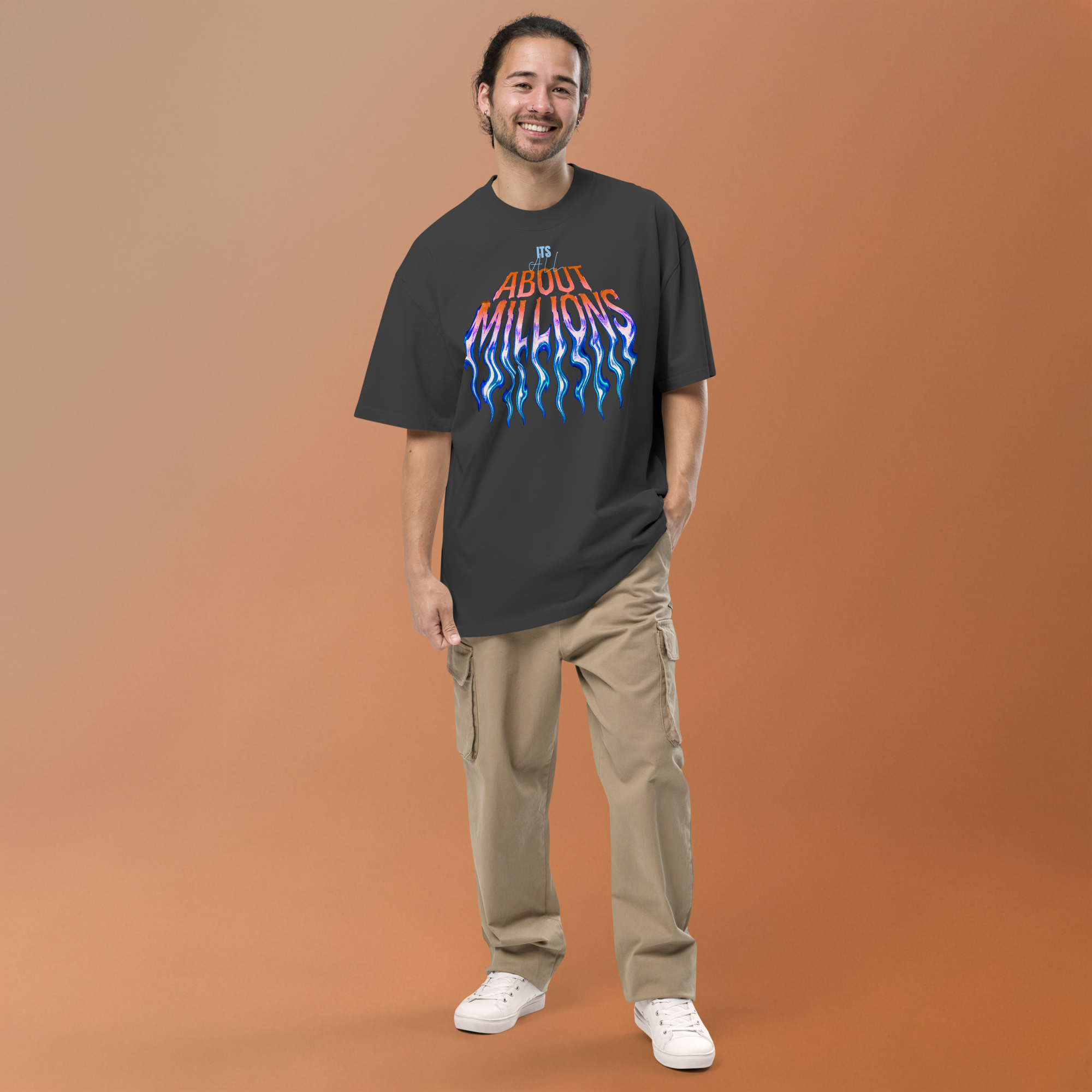Smiling man in 'About Millions' graphic tee