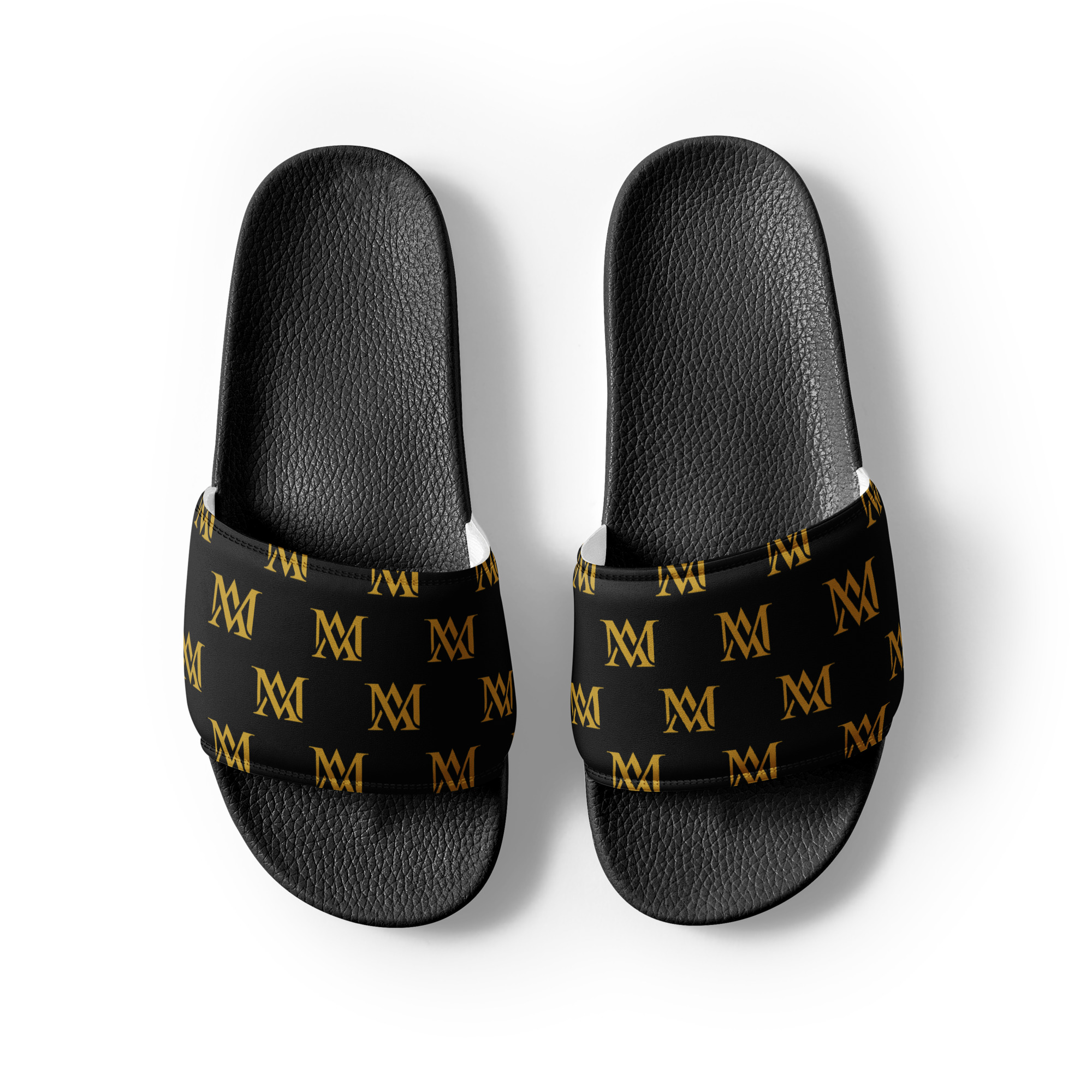 Black slides with gold M monogram pattern