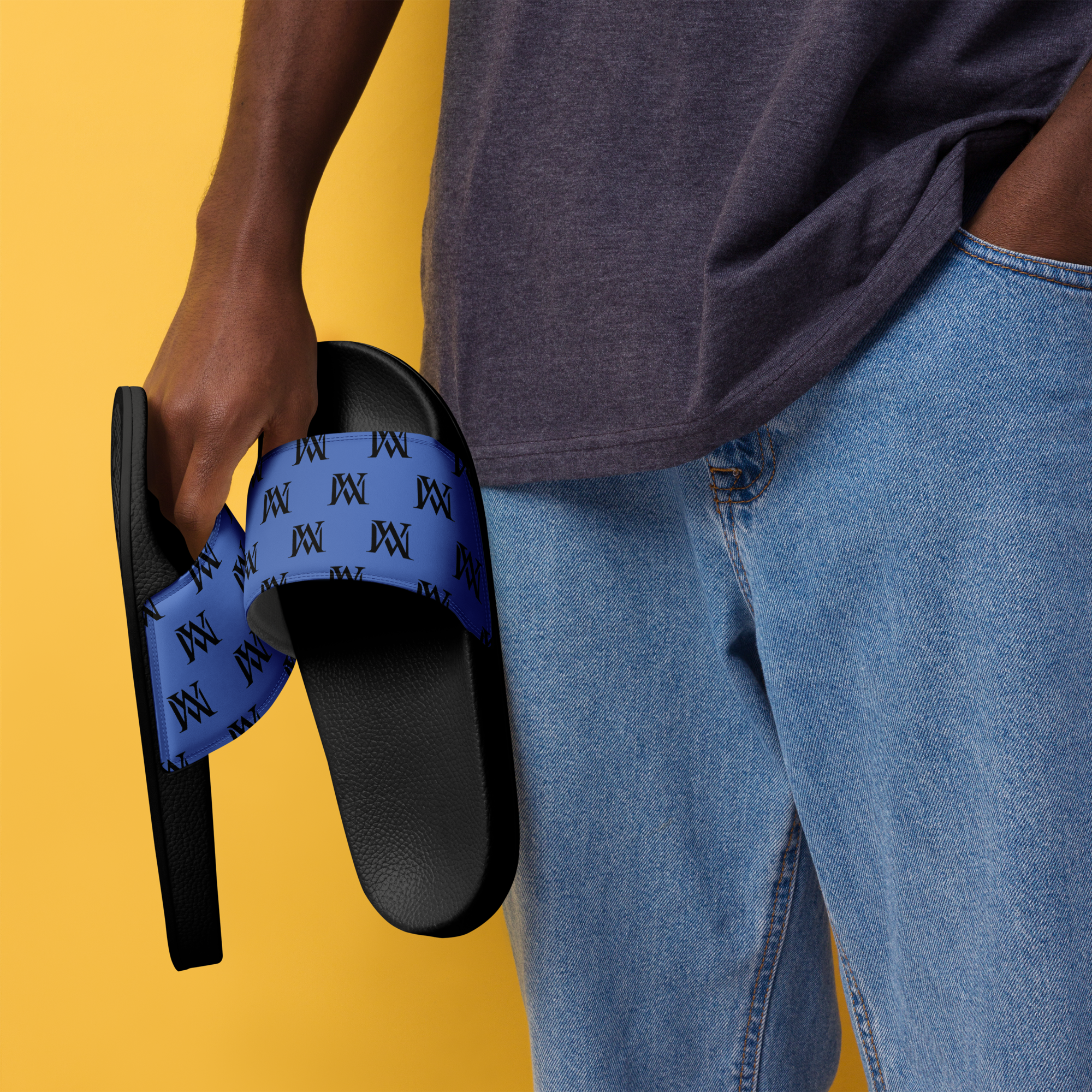 Hand holding blue patterned slides against yellow