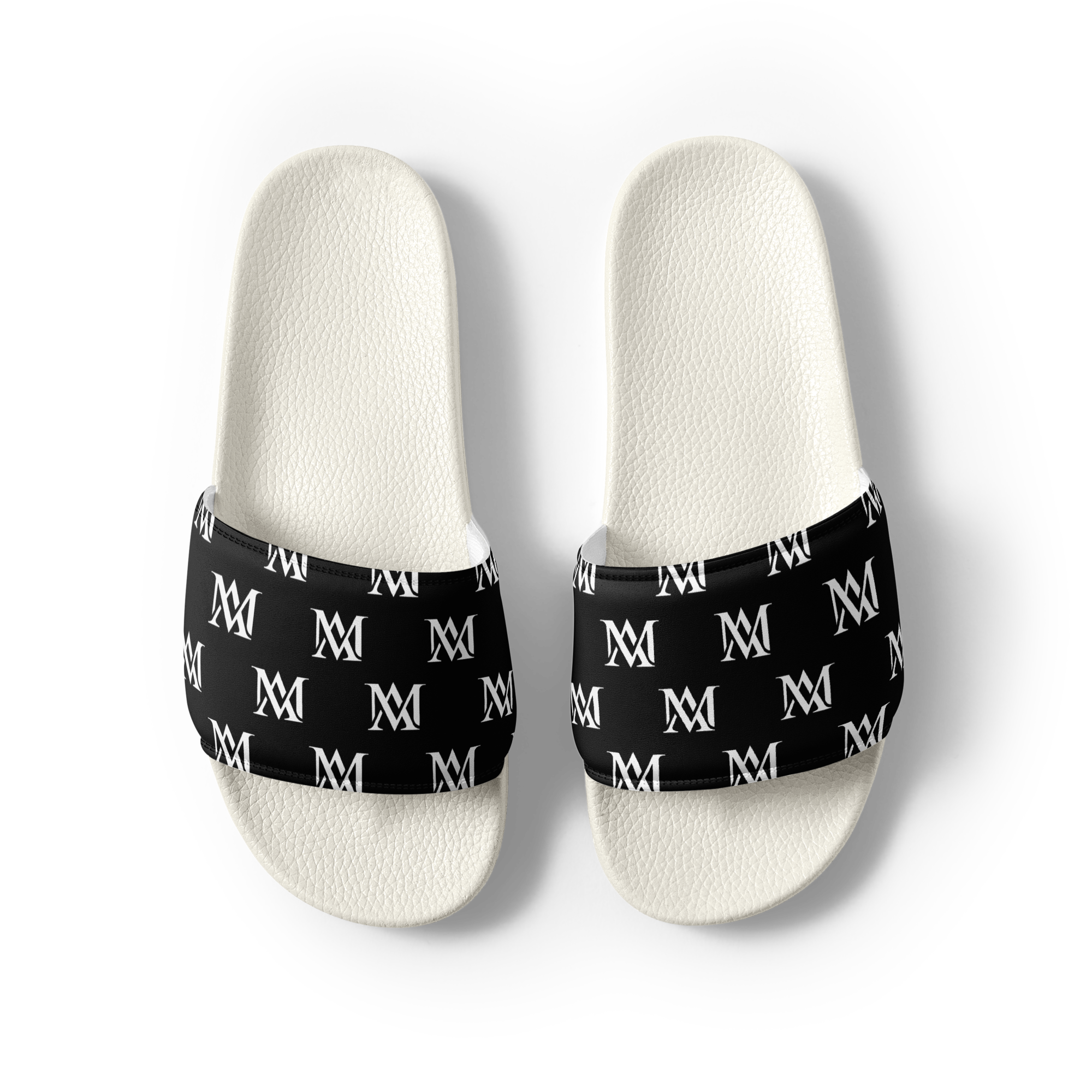 Pair of white slides with black monogram straps