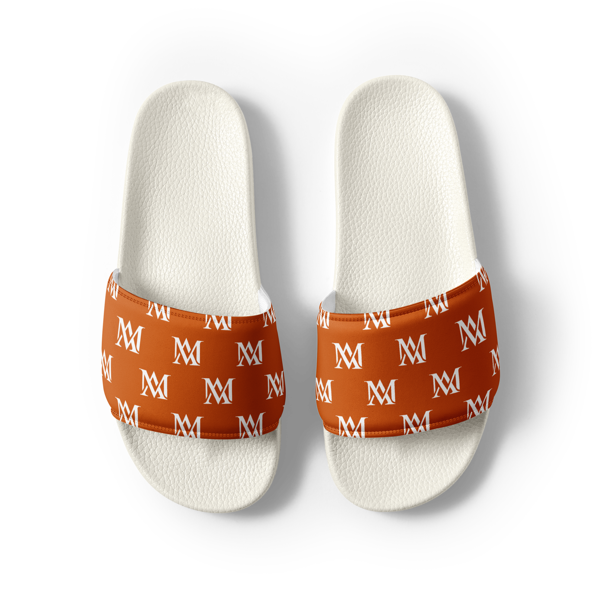 White slide sandals with orange monogram straps