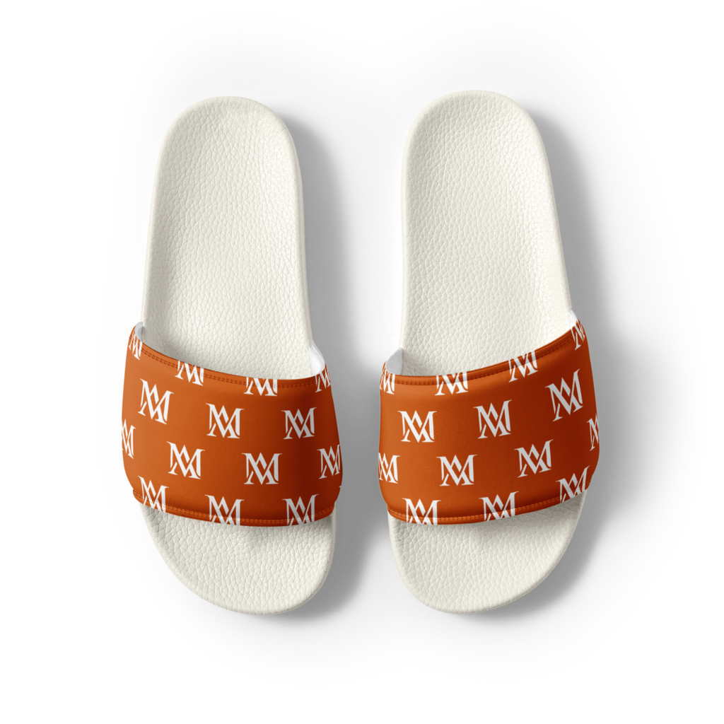 White slides with orange monogrammed straps