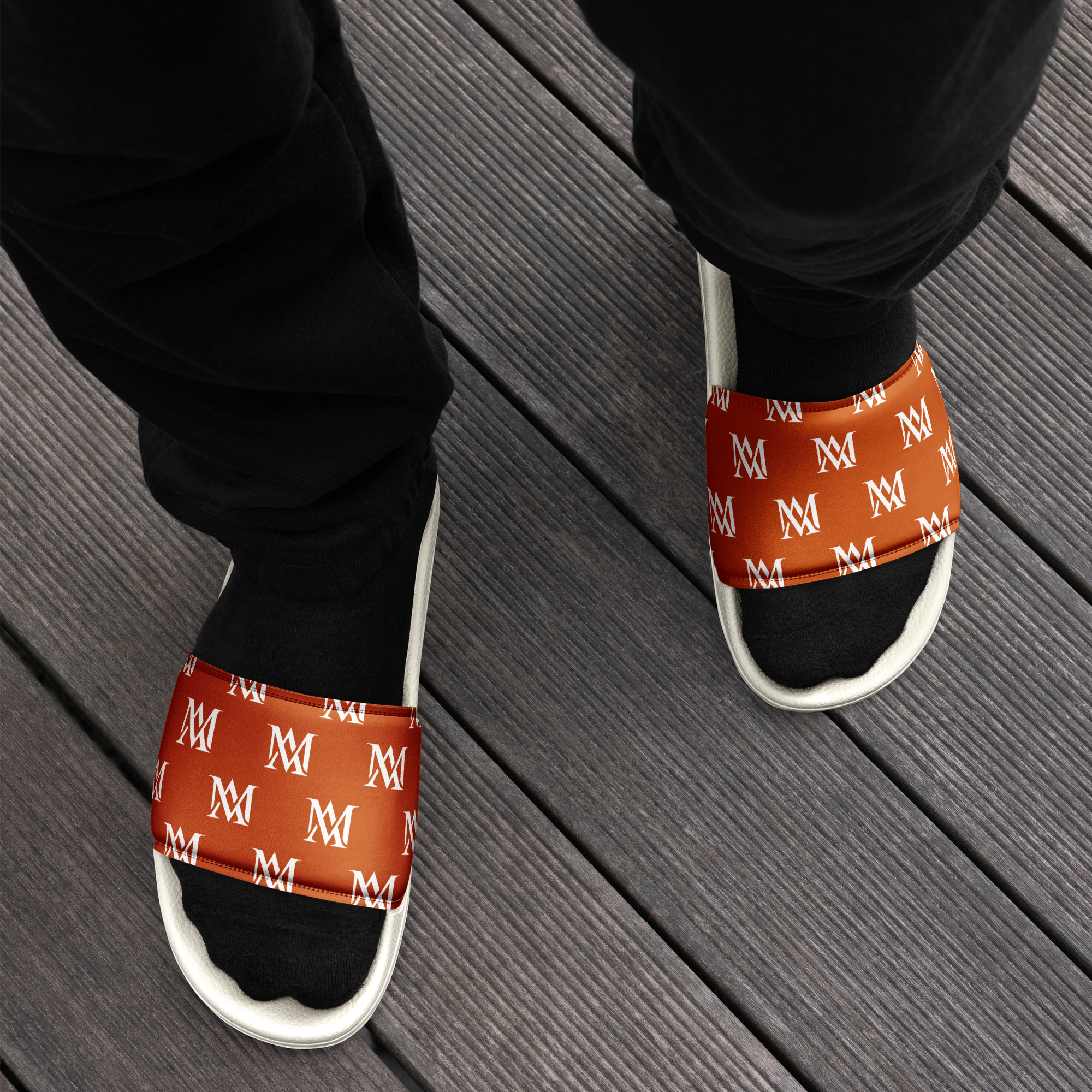 Black socks, orange monogram slides on deck