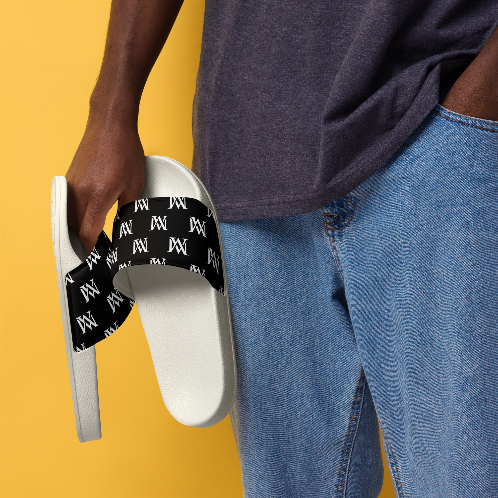 White slide sandals with black logo strap