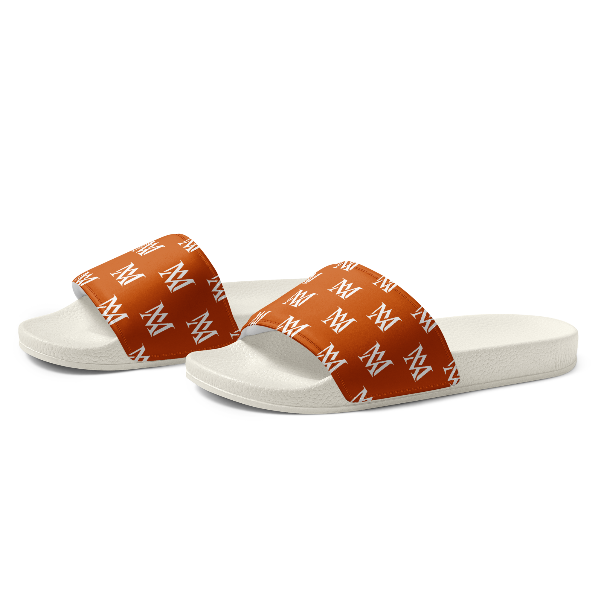 White slide sandals with orange patterned straps