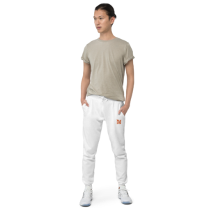 Person wearing beige t-shirt and white joggers