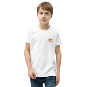 Boy in white t-shirt standing against black background