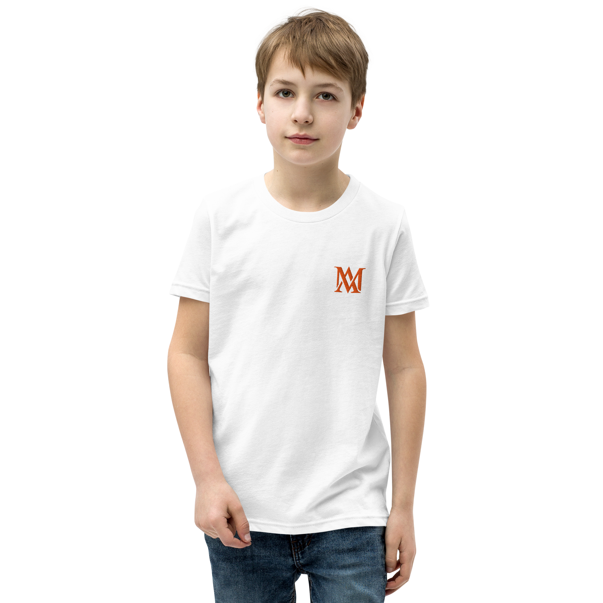 Boy in white t-shirt standing against black background